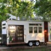 Hybrid tiny house trailer with rooftop patio